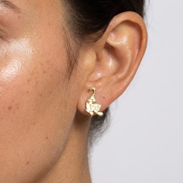 Pair of gold tiger stud earrings shown in profile with stripe detail