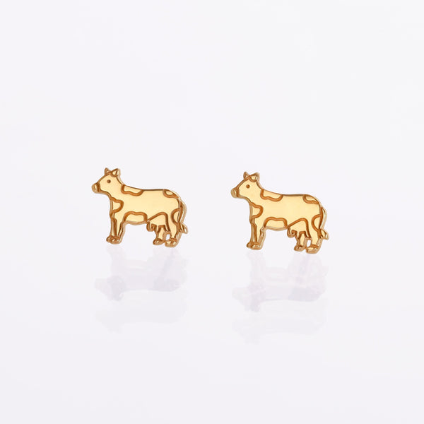 Pair of small rose gold cow face stud earrings with patch markings