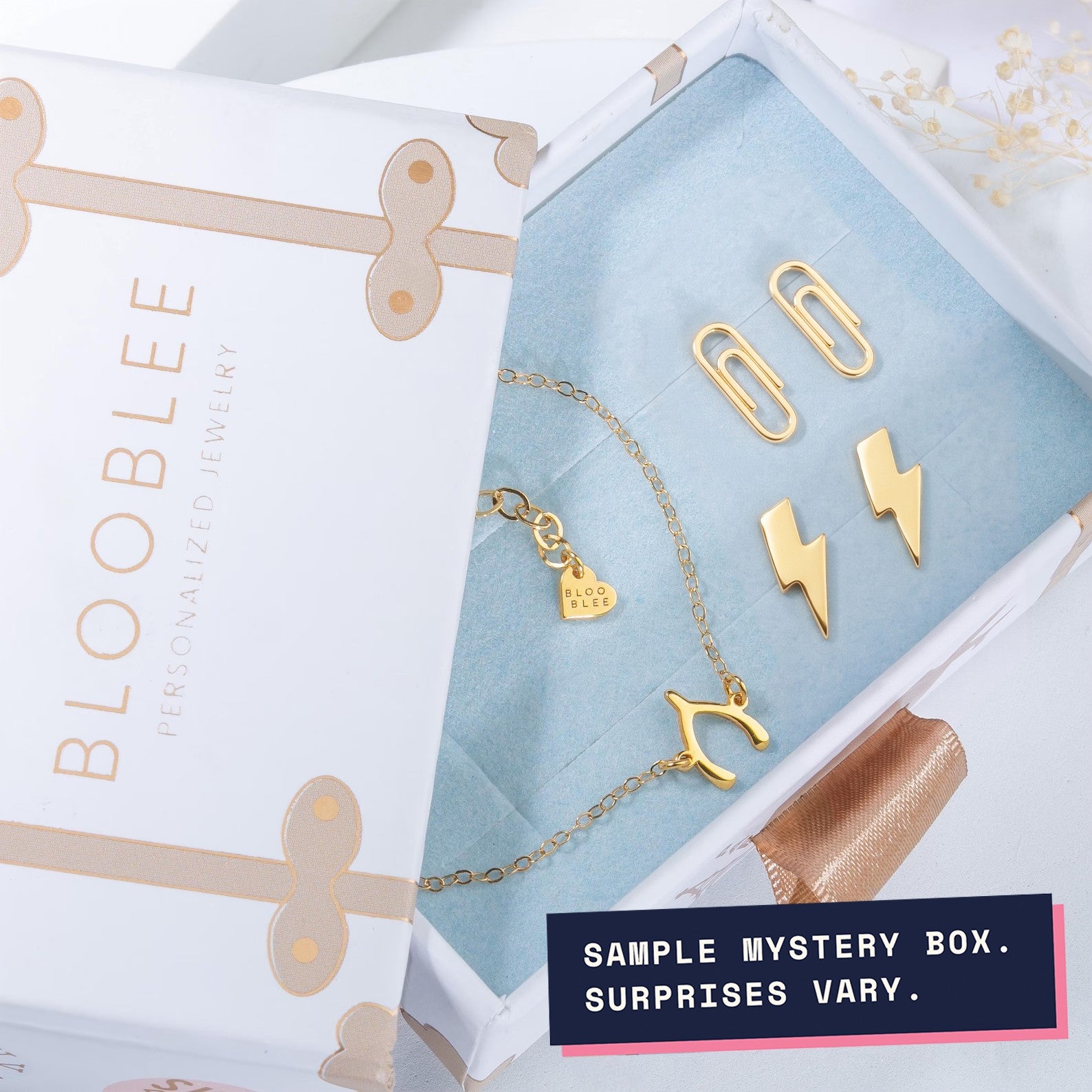 Sample Blooblee mystery box: wishbone bracelet, paperclip and lightning bolt studs