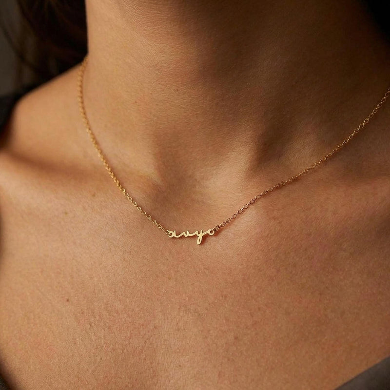 Fine gold cursive script name pendant on a dainty cable chain (13 of 18)