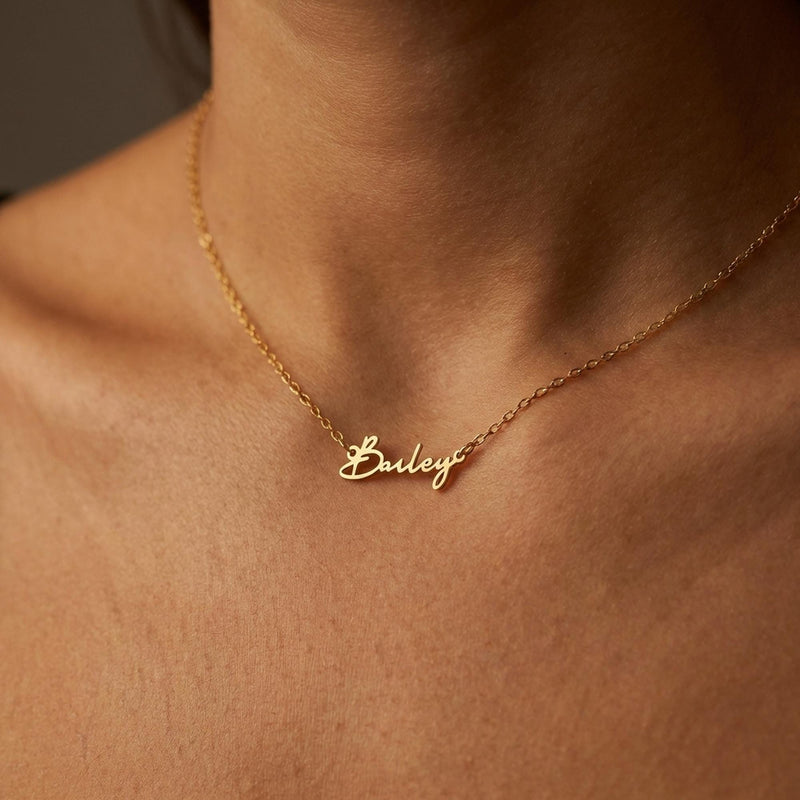 Fine gold cursive script name pendant on a dainty cable chain (14 of 18)