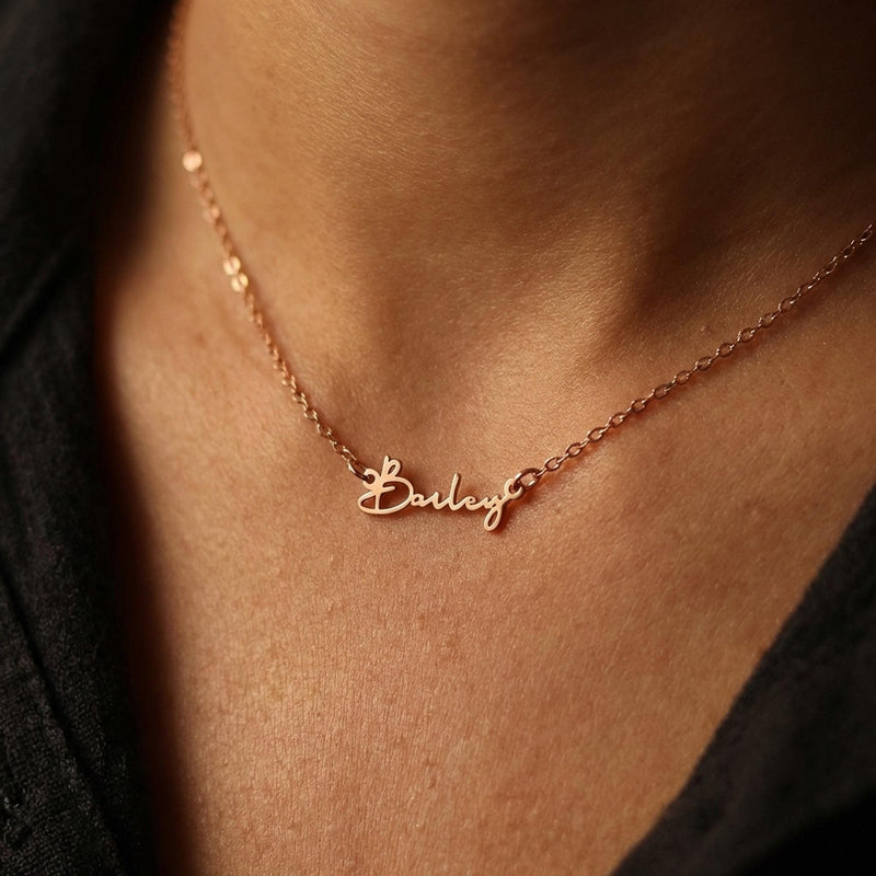 Fine gold cursive script name pendant on a dainty cable chain (15 of 18)
