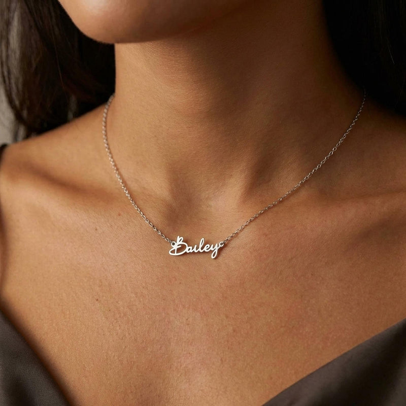 Fine gold cursive script name pendant on a dainty cable chain (16 of 18)