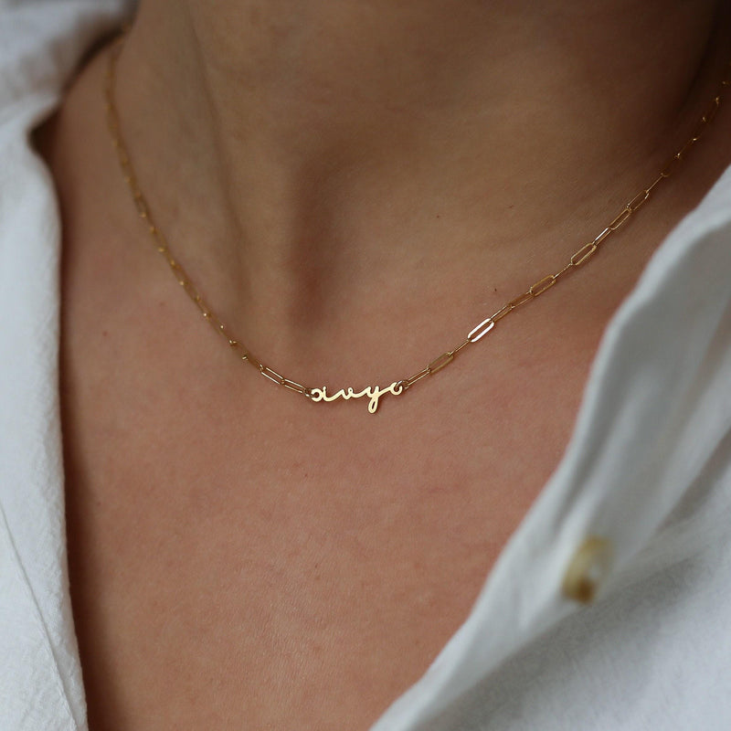 Fine gold cursive script name pendant on a dainty cable chain (6 of 18)