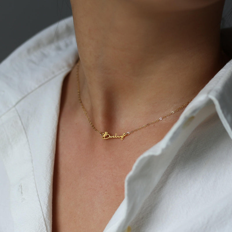 Fine gold cursive script name pendant on a dainty cable chain (8 of 18)