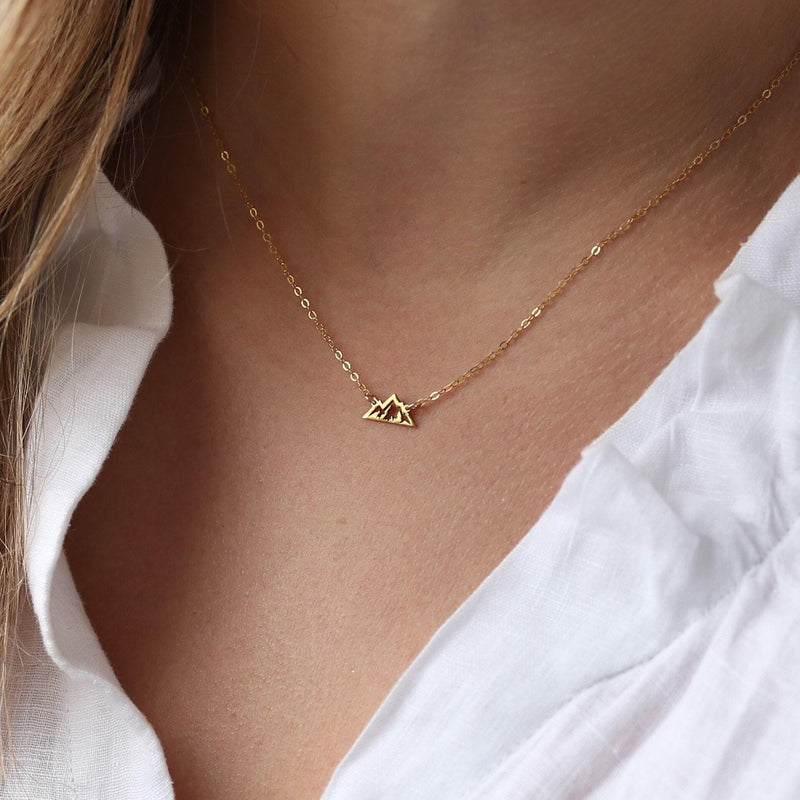 Tiny gold mountain peak pendant on a fine cable chain, shown flat on a white background (2 of 11)