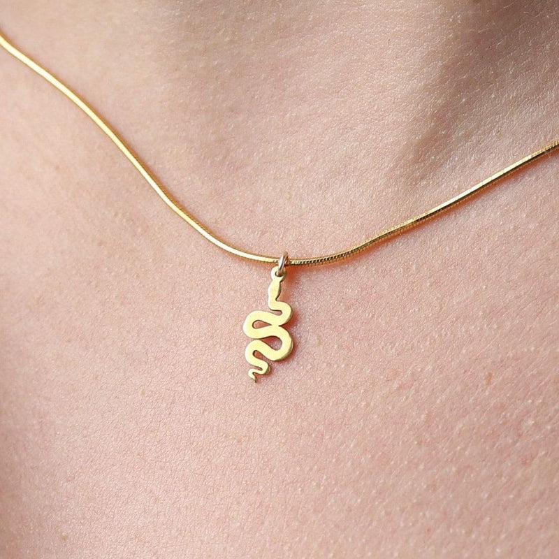 Small gold snake pendant curved into an S shape on a dainty cable chain choker (2 of 8)