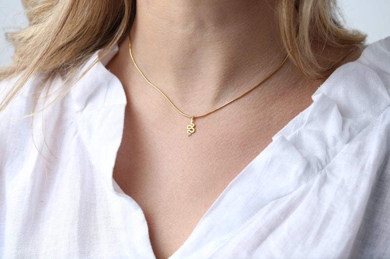 Small gold snake pendant curved into an S shape on a dainty cable chain choker (3 of 8)