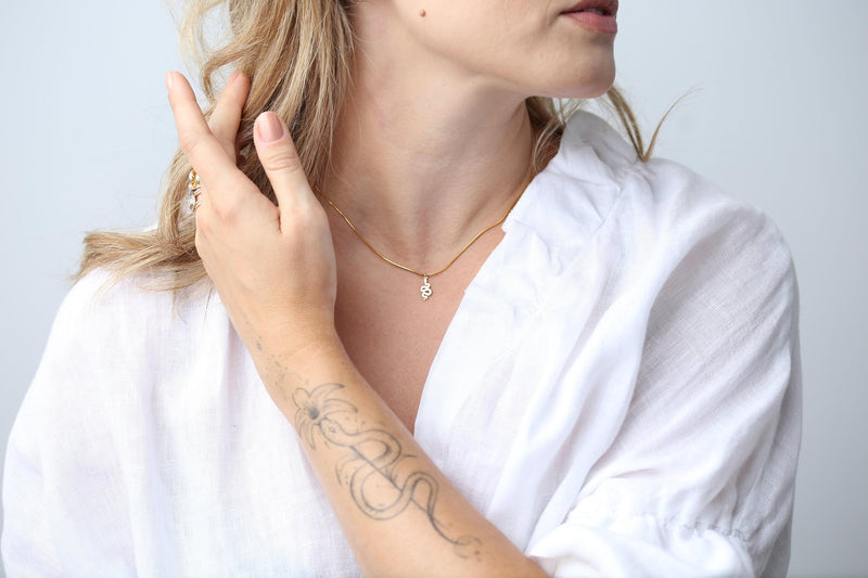 Small gold snake pendant curved into an S shape on a dainty cable chain choker (4 of 8)