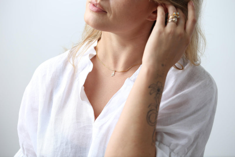Small gold snake pendant curved into an S shape on a dainty cable chain choker (5 of 8)