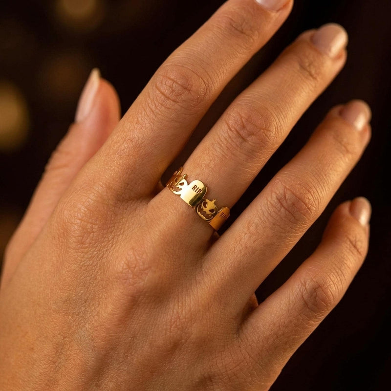 Thin gold stacking ring with a small RIP tombstone charm on the crown (10 of 15)