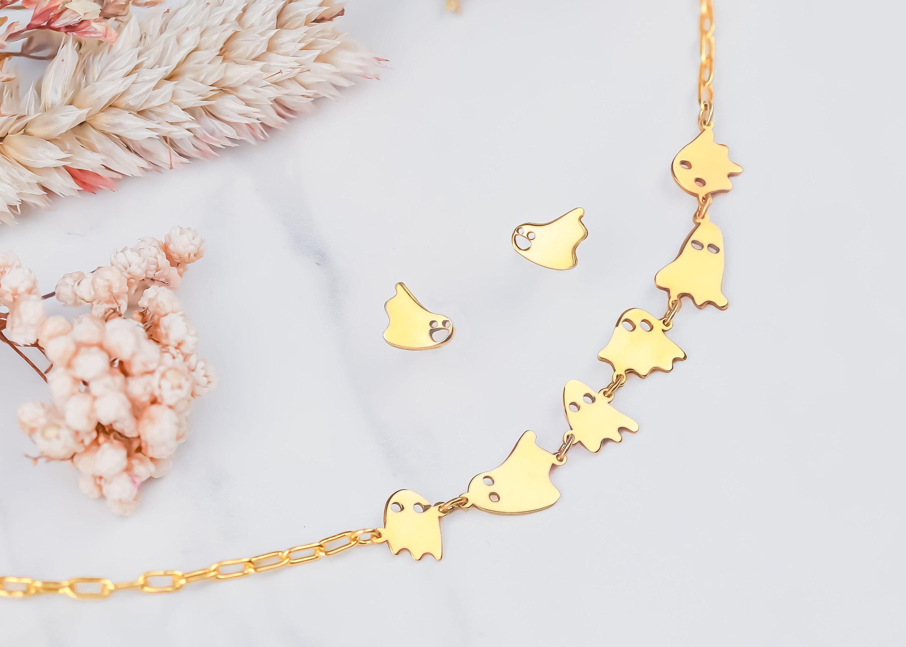 Small gold ghost pendant with wavy hem on a fine chain necklace (2 of 6)
