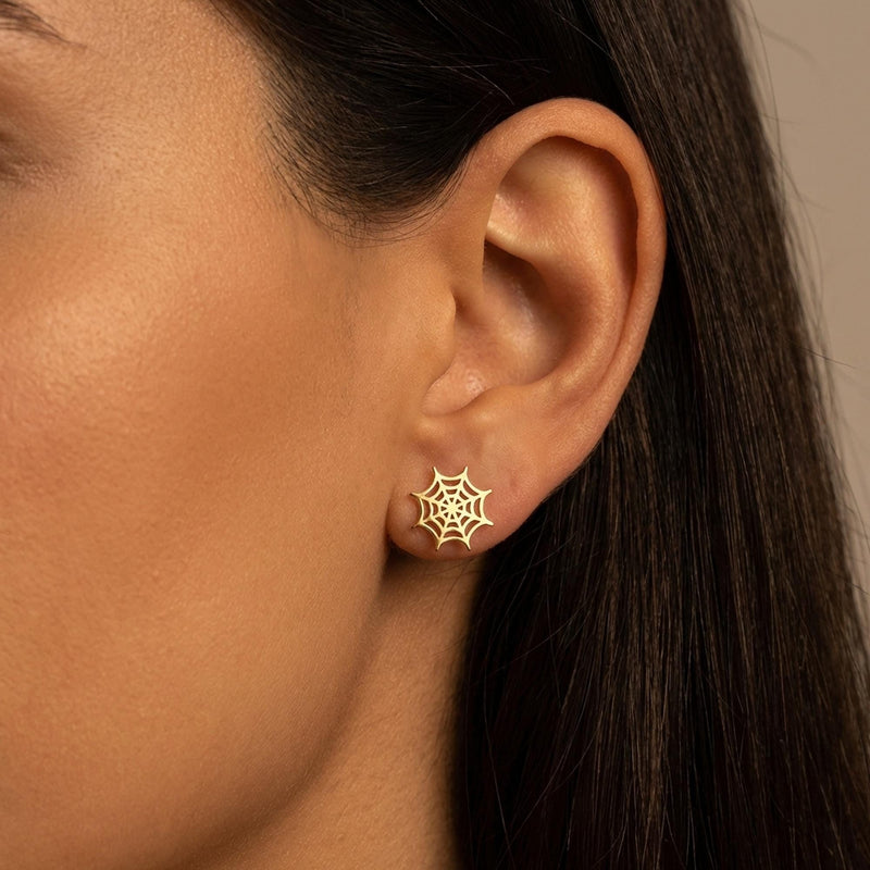 Pair of gold spider web dangle earrings with open line work (9 of 9)
