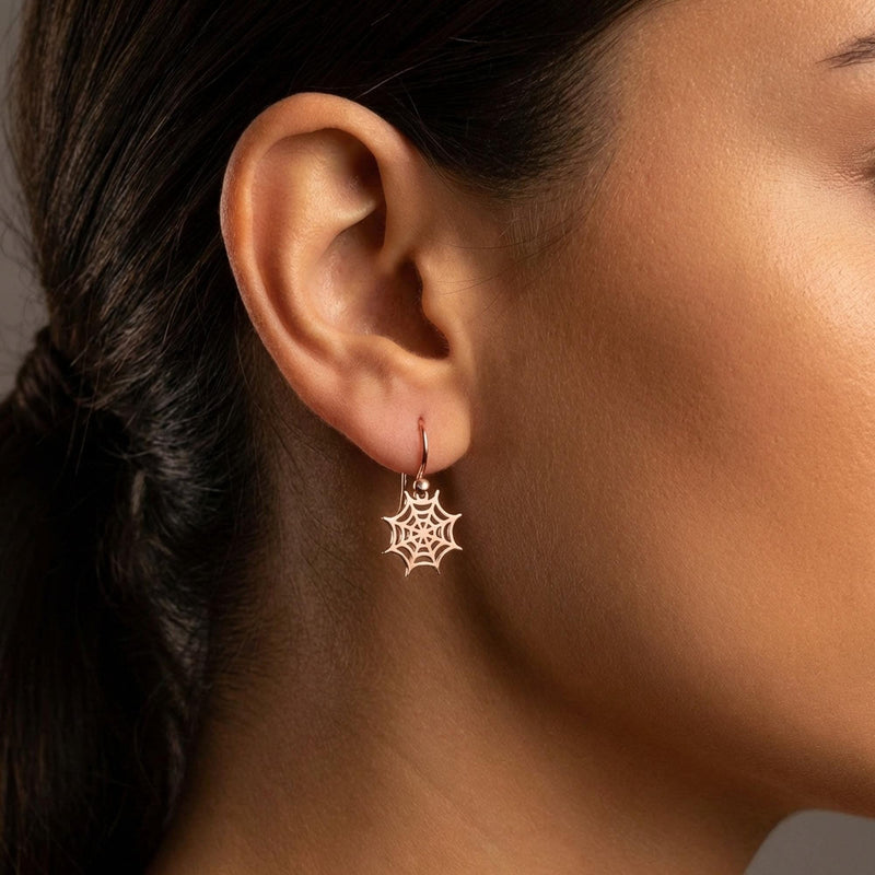Pair of tiny gold spider web earrings with fine radiating threads (3 of 7)
