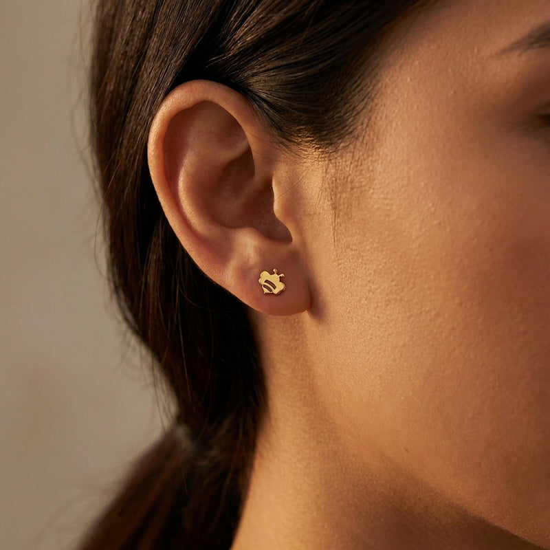 Pair of very small flat bee stud earrings in polished gold (7 of 12)