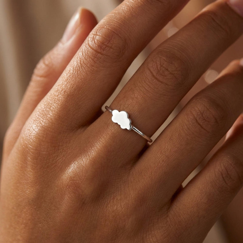 Dainty gold ring with a small cloud shape sitting on a thin round band (5 of 14)