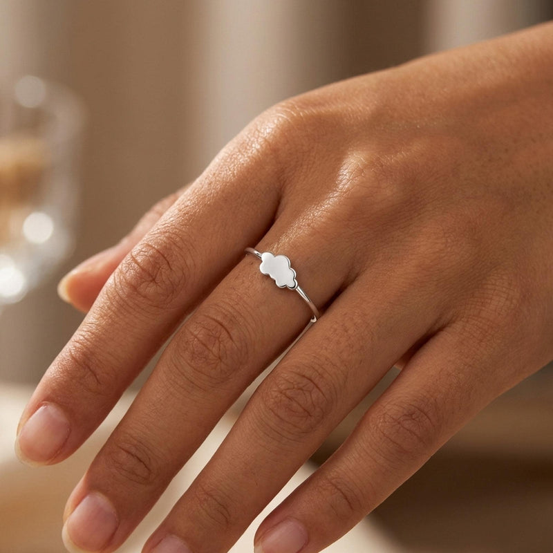 Dainty gold ring with a small cloud shape sitting on a thin round band (6 of 14)