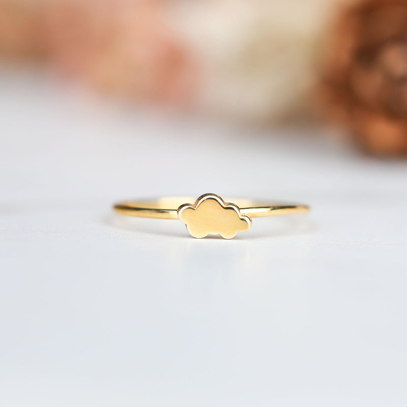 Dainty gold ring with a small cloud shape sitting on a thin round band (9 of 14)