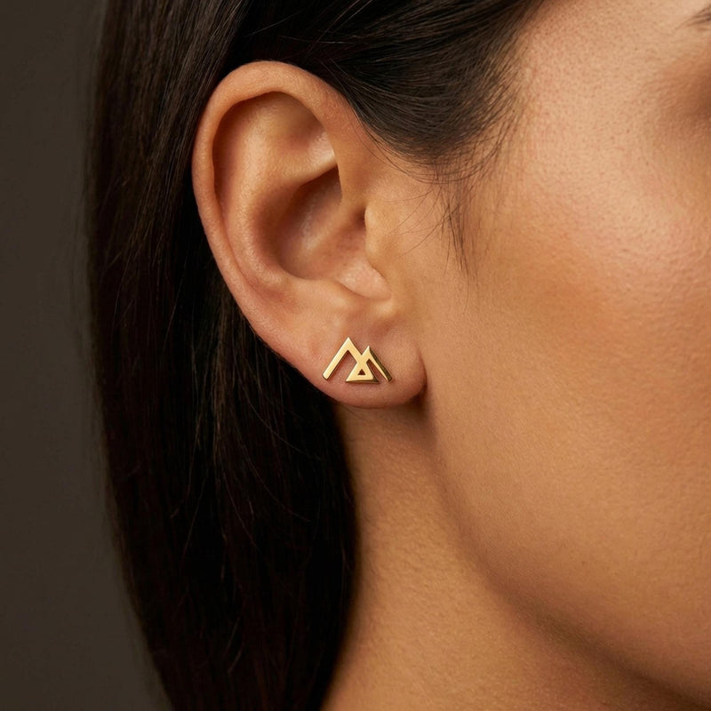 Small gold geometric mountain stud earrings with angular peaks, shown as a pair (11 of 14)