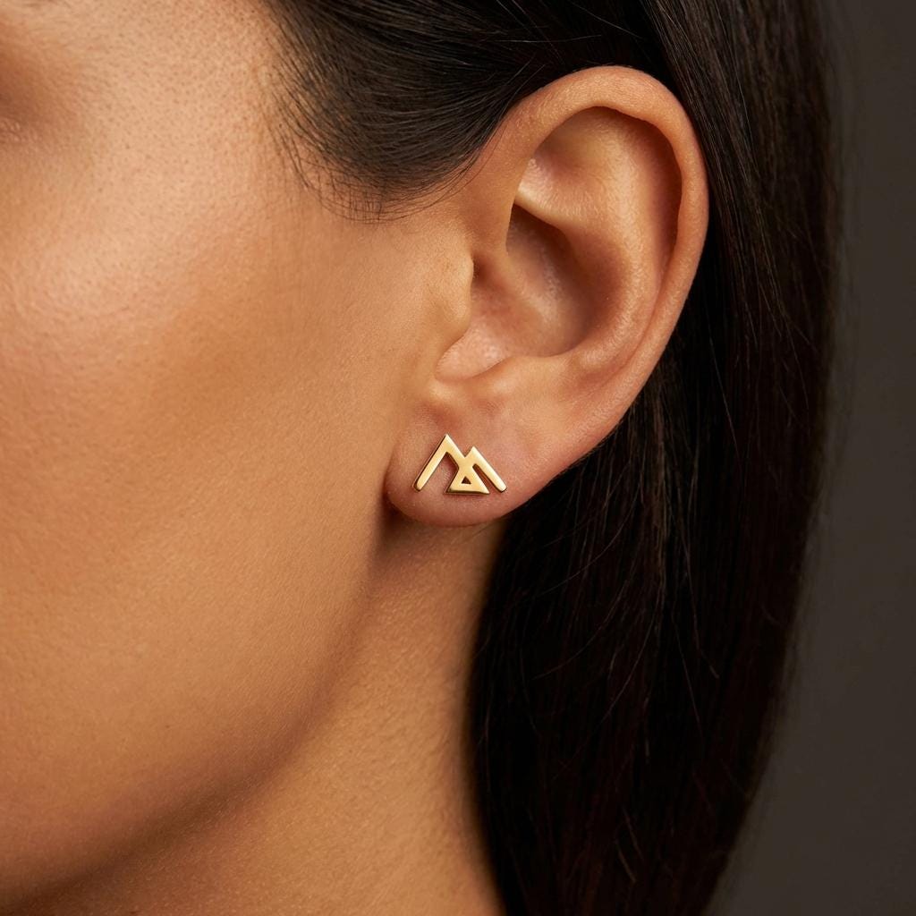 Small gold geometric mountain stud earrings with angular peaks, shown as a pair (2 of 14)