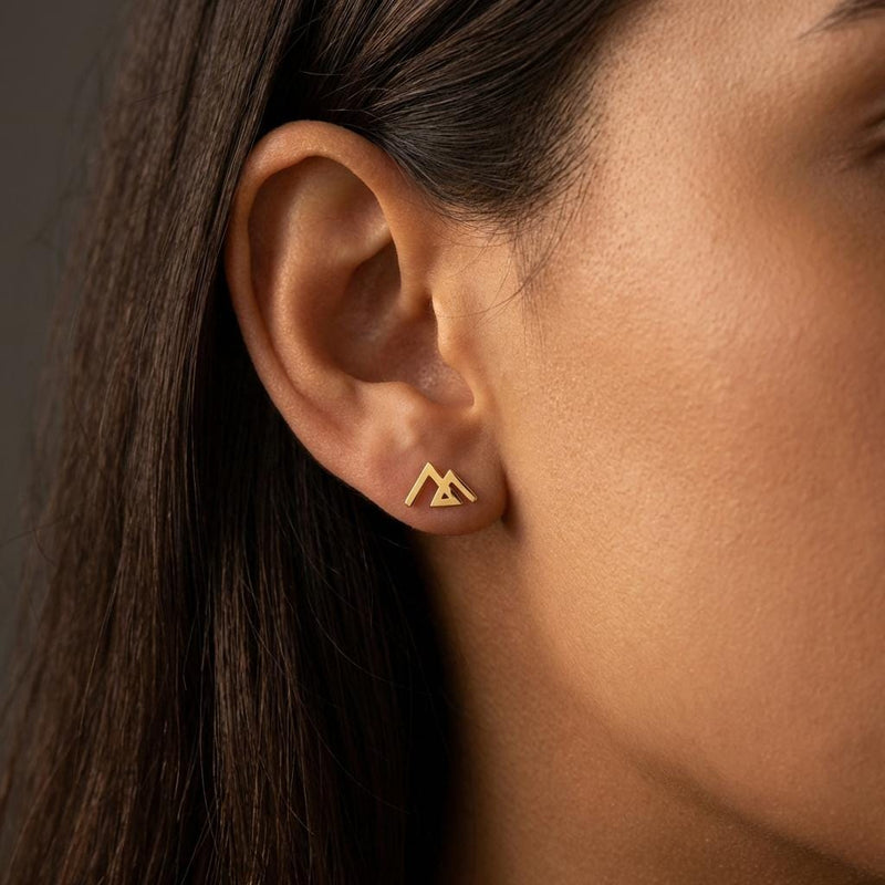 Small gold geometric mountain stud earrings with angular peaks, shown as a pair (5 of 14)