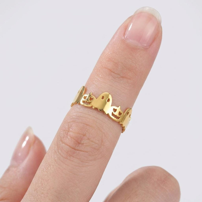 Dainty gold Halloween ring with a small sculpted top on a thin band