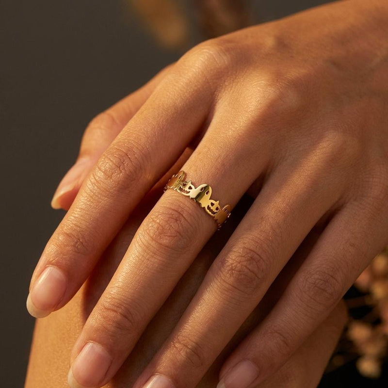 Dainty gold Halloween ring with a small sculpted top on a thin band (7 of 12)