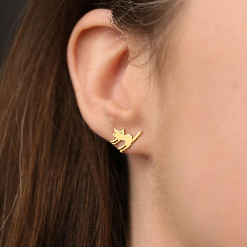 Pair of small gold cat stud earrings showing a seated cat with curled tail (3 of 8)