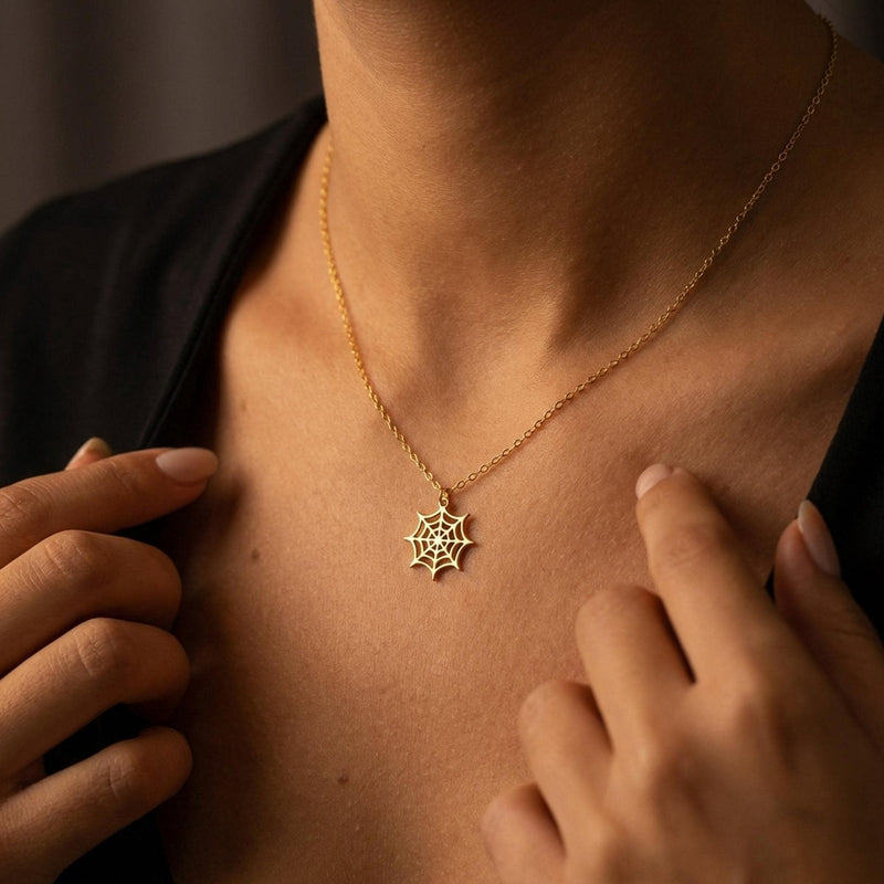 Dainty gold spider web pendant with fine radial threads, hanging from a thin gold-filled cable chain (6 of 13)