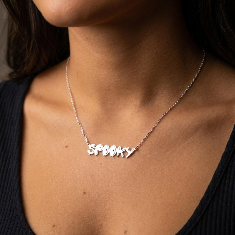 Gold script word pendant reading spooky with connected letters on a fine chain (3 of 10)