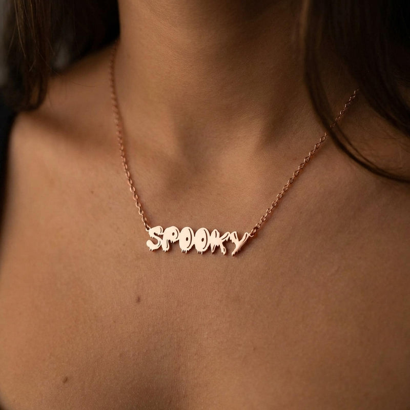 Gold script word pendant reading spooky with connected letters on a fine chain (4 of 10)