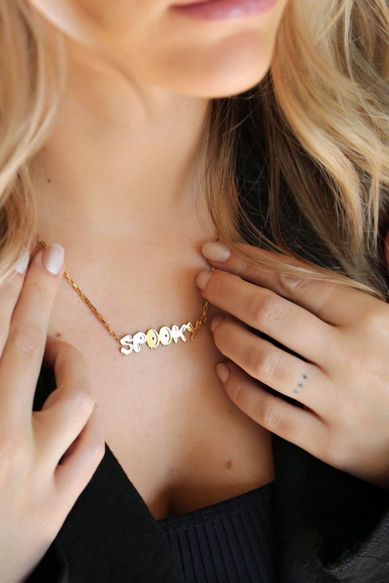 Gold script word pendant reading spooky with connected letters on a fine chain (5 of 10)