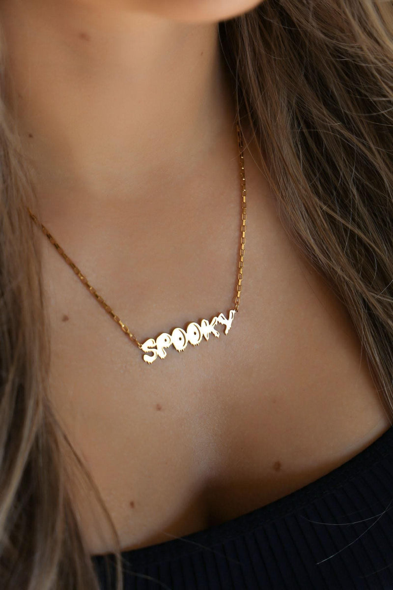 Gold script word pendant reading spooky with connected letters on a fine chain (6 of 10)
