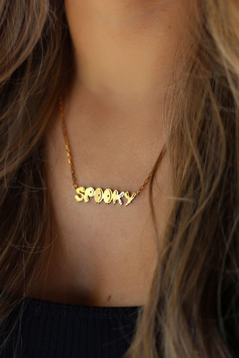 Gold script word pendant reading spooky with connected letters on a fine chain (7 of 10)