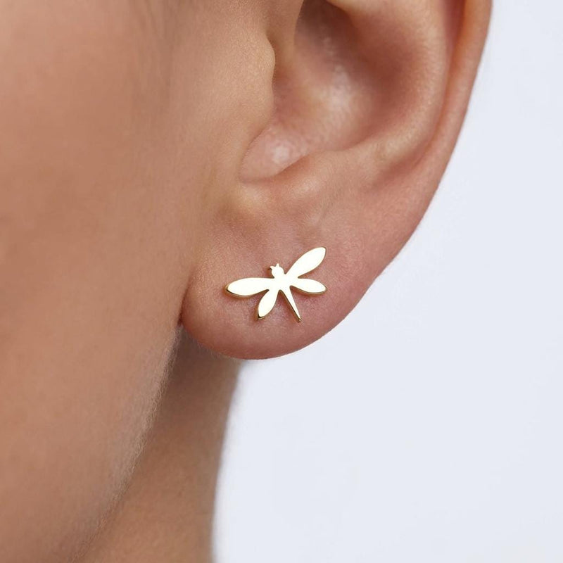 Pair of narrow gold dragonfly stud earrings with four wings, shown front on. (2 of 11)