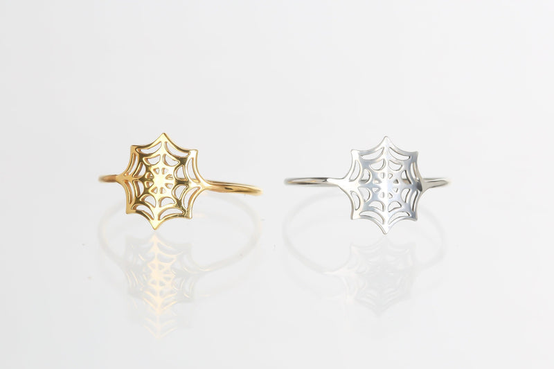 Thin gold ring with a delicate spider web pattern traced around the band (11 of 16)