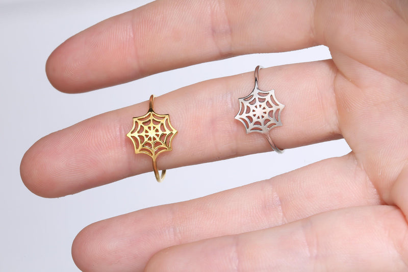 Thin gold ring with a delicate spider web pattern traced around the band (12 of 16)