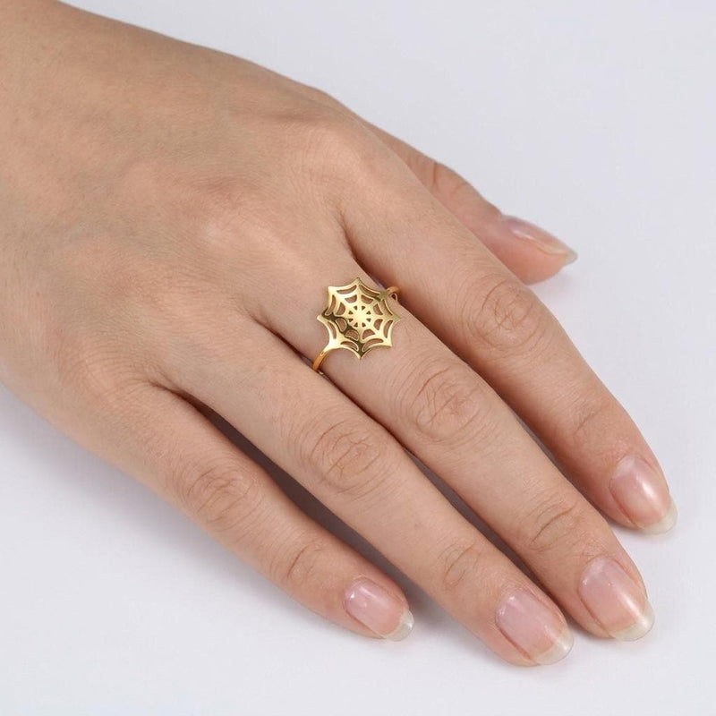 Thin gold ring with a delicate spider web pattern traced around the band (3 of 16)
