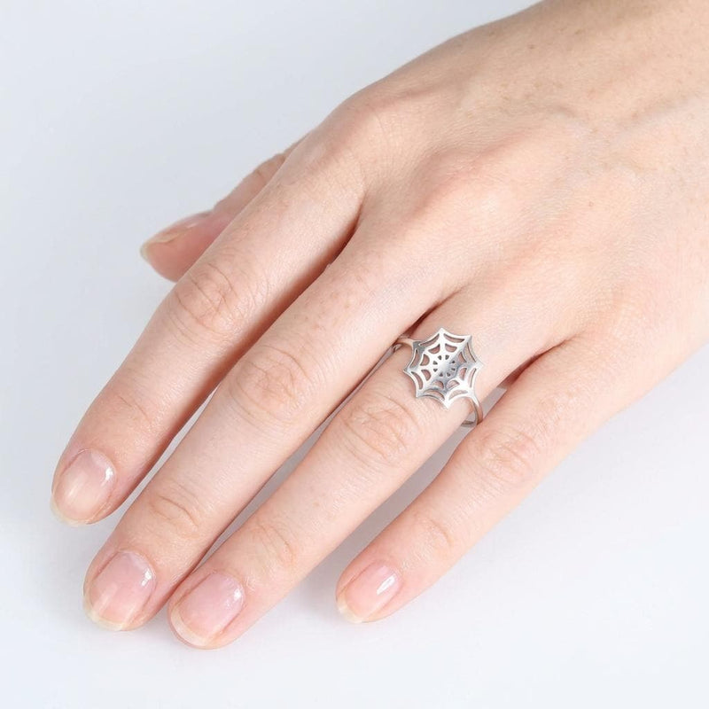 Thin gold ring with a delicate spider web pattern traced around the band (5 of 16)