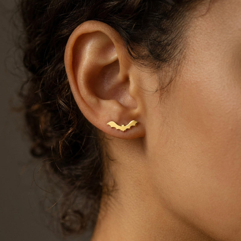 Pair of flat bat stud earrings with outstretched wings, in gold (2 of 10)