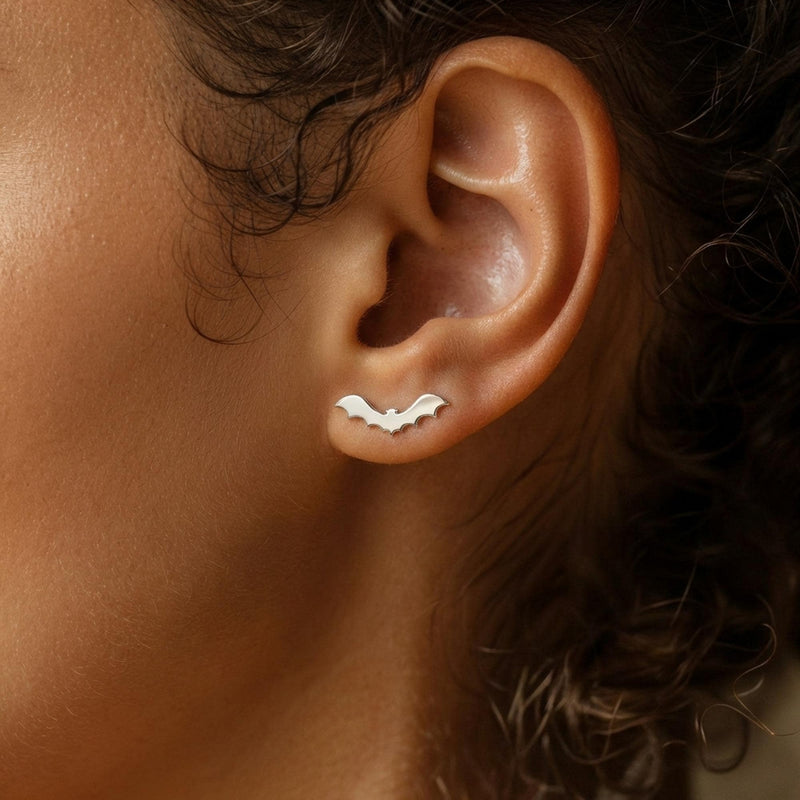 Pair of flat bat stud earrings with outstretched wings, in gold (6 of 10)