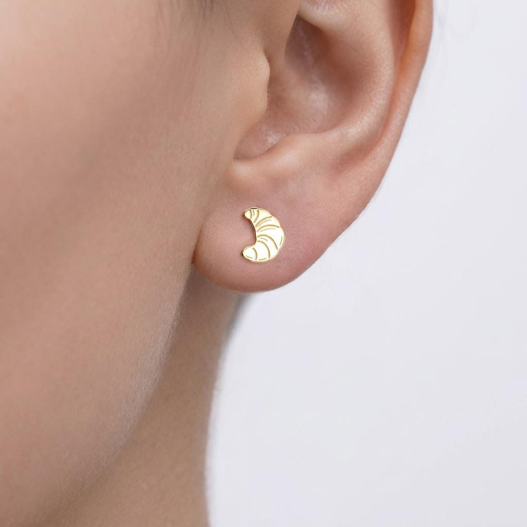 Pair of tiny gold croissant stud earrings with scored curved tops