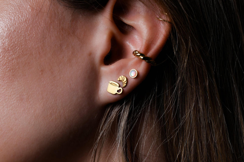 Pair of tiny gold croissant stud earrings with scored curved tops (8 of 9)
