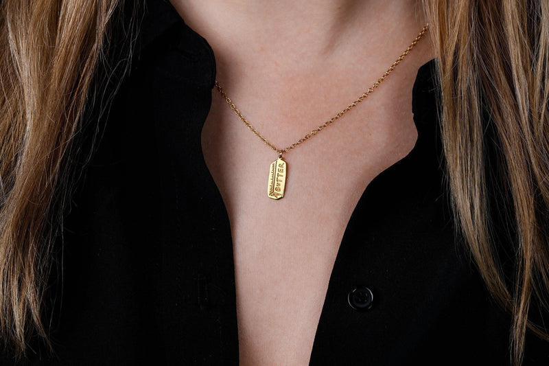 Fine gold chain necklace with a small pendant shaped like a stick of butter (4 of 13)