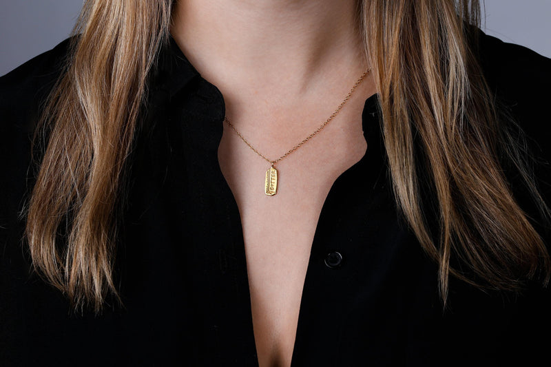 Fine gold chain necklace with a small pendant shaped like a stick of butter (5 of 13)