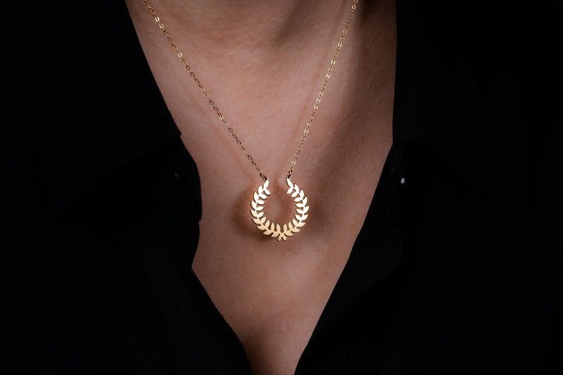 Gold laurel wreath pendant with two leafy branches meeting at the base on a chain (4 of 9)