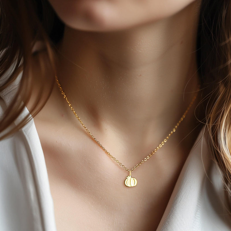 Fine gold chain necklace with a small ribbed pumpkin pendant and curled stem (2 of 6)