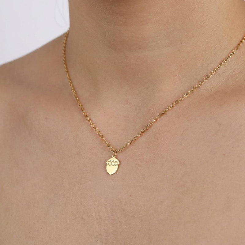 Tiny gold acorn pendant with a textured cap on a fine chain (2 of 6)