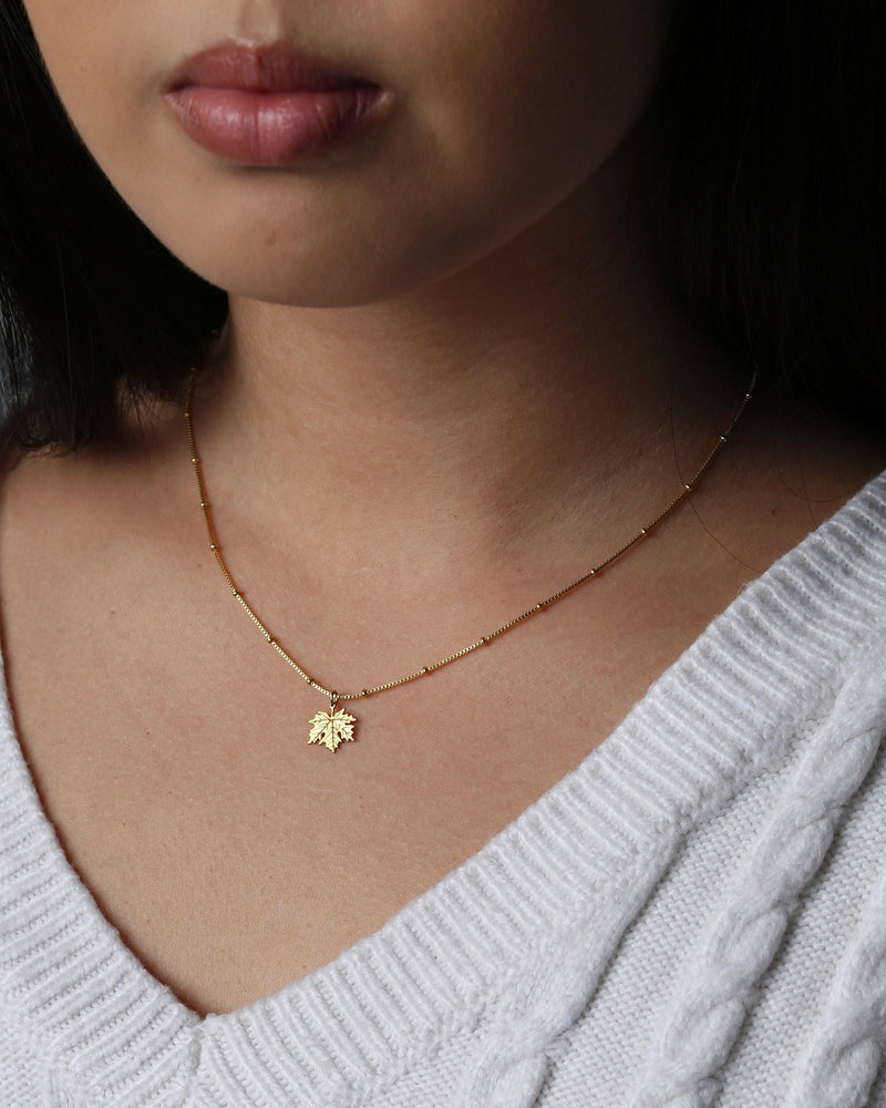 Dainty gold maple leaf pendant on a fine cable chain (6 of 12)