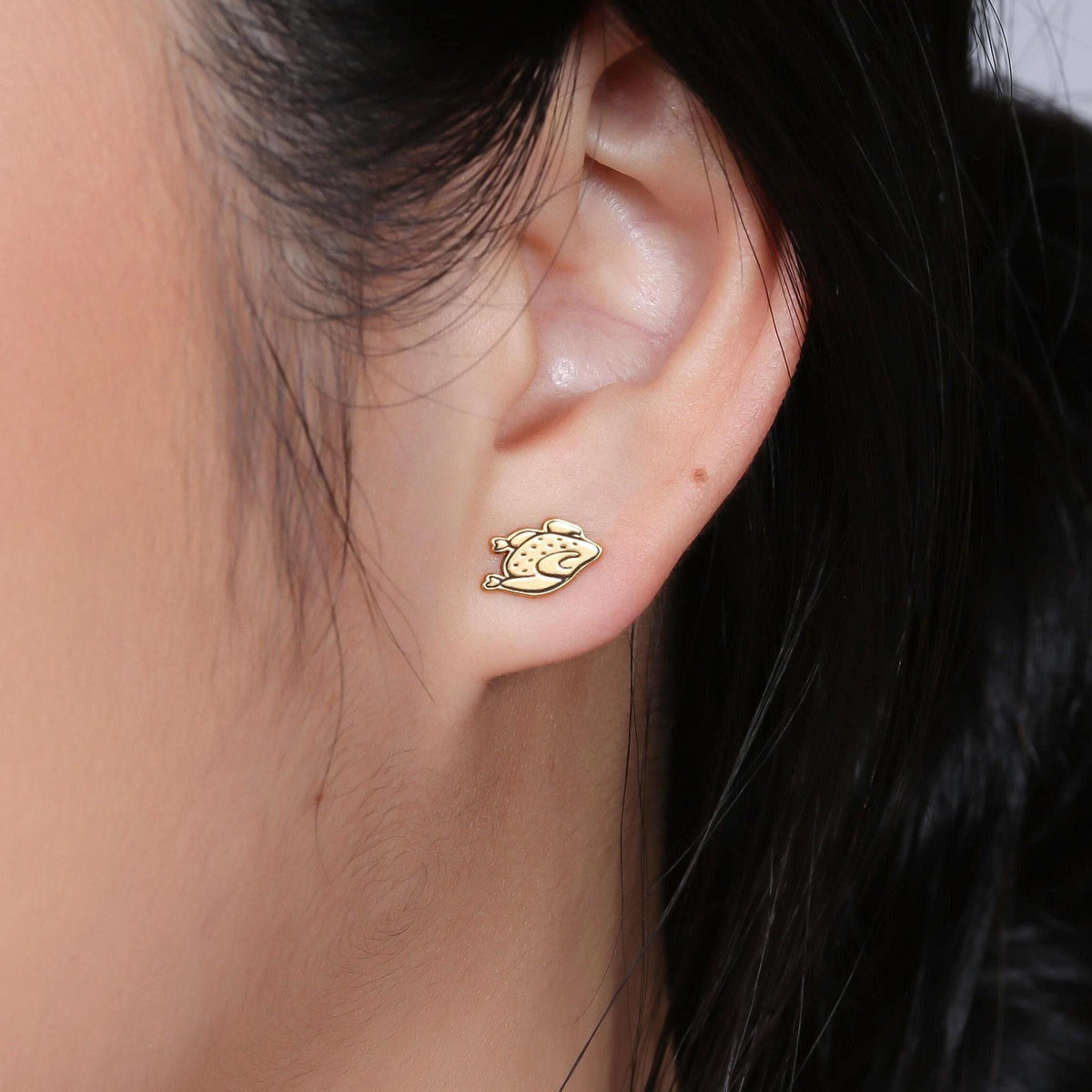 Pair of small gold turkey stud earrings with fanned tails, front view.